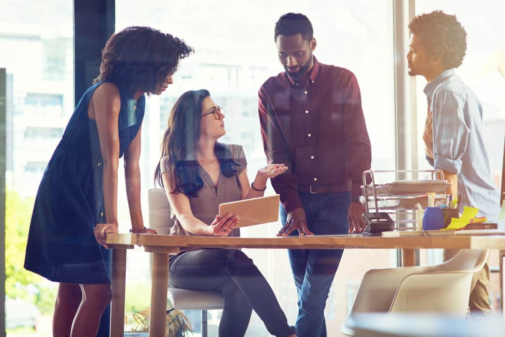 Shot of a group of businesspeople having a discussion in an office