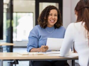 Office manager talks to the new intern