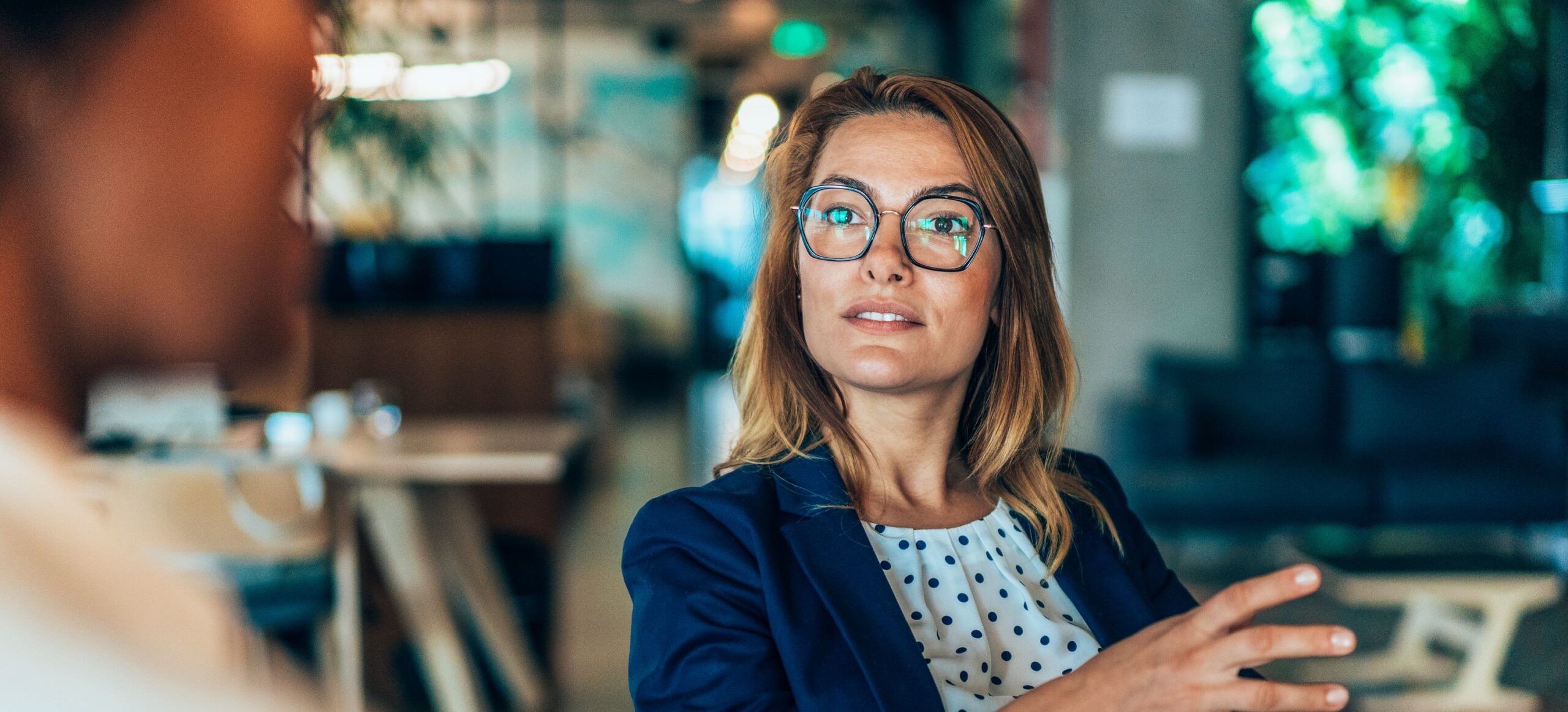 A woman speaking in a corporate environment